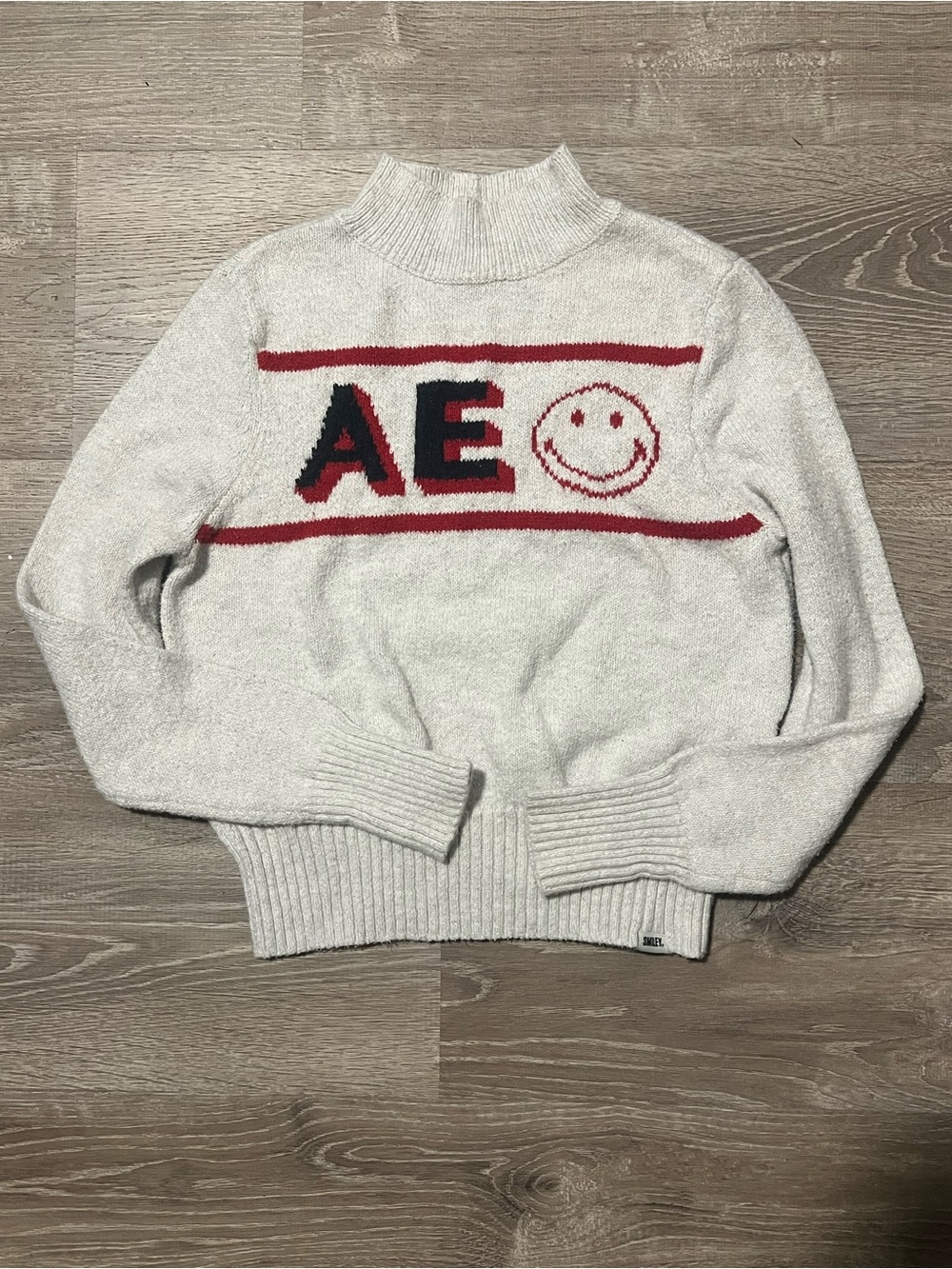 American Eagle x Smiley White Mock Neck Knit
Sweater Size M